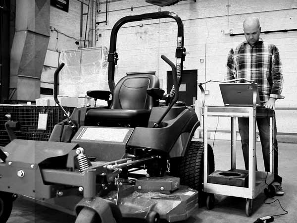 Distributor standing next to equipment powered by a Vanguard engine